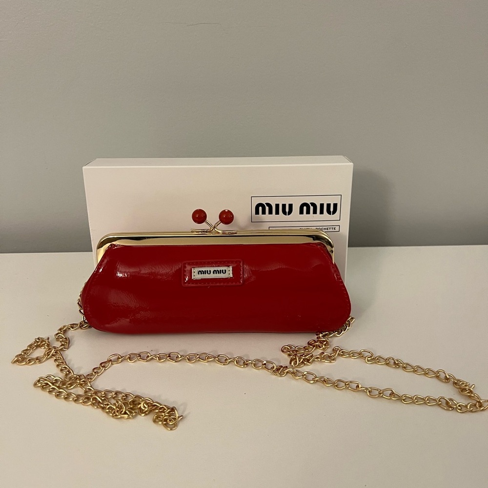 Miu Miu Red Kisslock Clutch with DIOR beauty miniatures